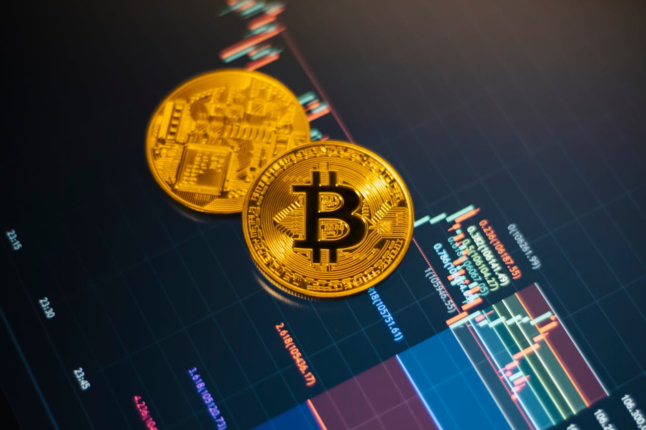 about-01 Golden Bitcoin coins on a digital stock market chart showcasing cryptocurrency trading.