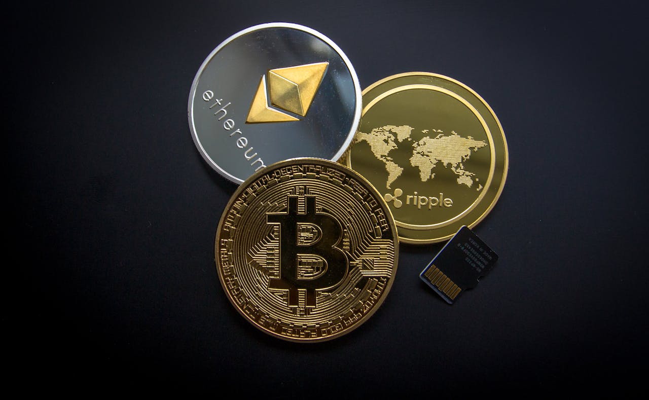 services-01 A striking image of Bitcoin, Ethereum, and Ripple coins illustrating modern digital currency.